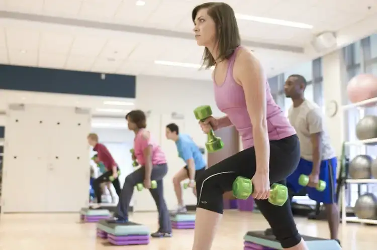 men and women performing aerobic exercises
